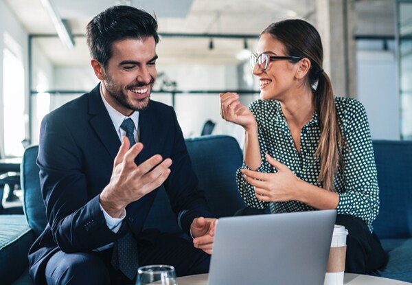 Male and female coworker talking in an office