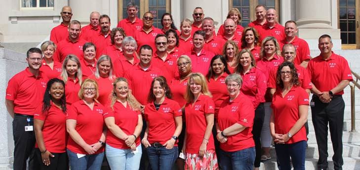 More than 40 members of MassMutual's Armed Forces, Veterans and Families (AFVF) Business Resource Group posing on MassMutual's steps