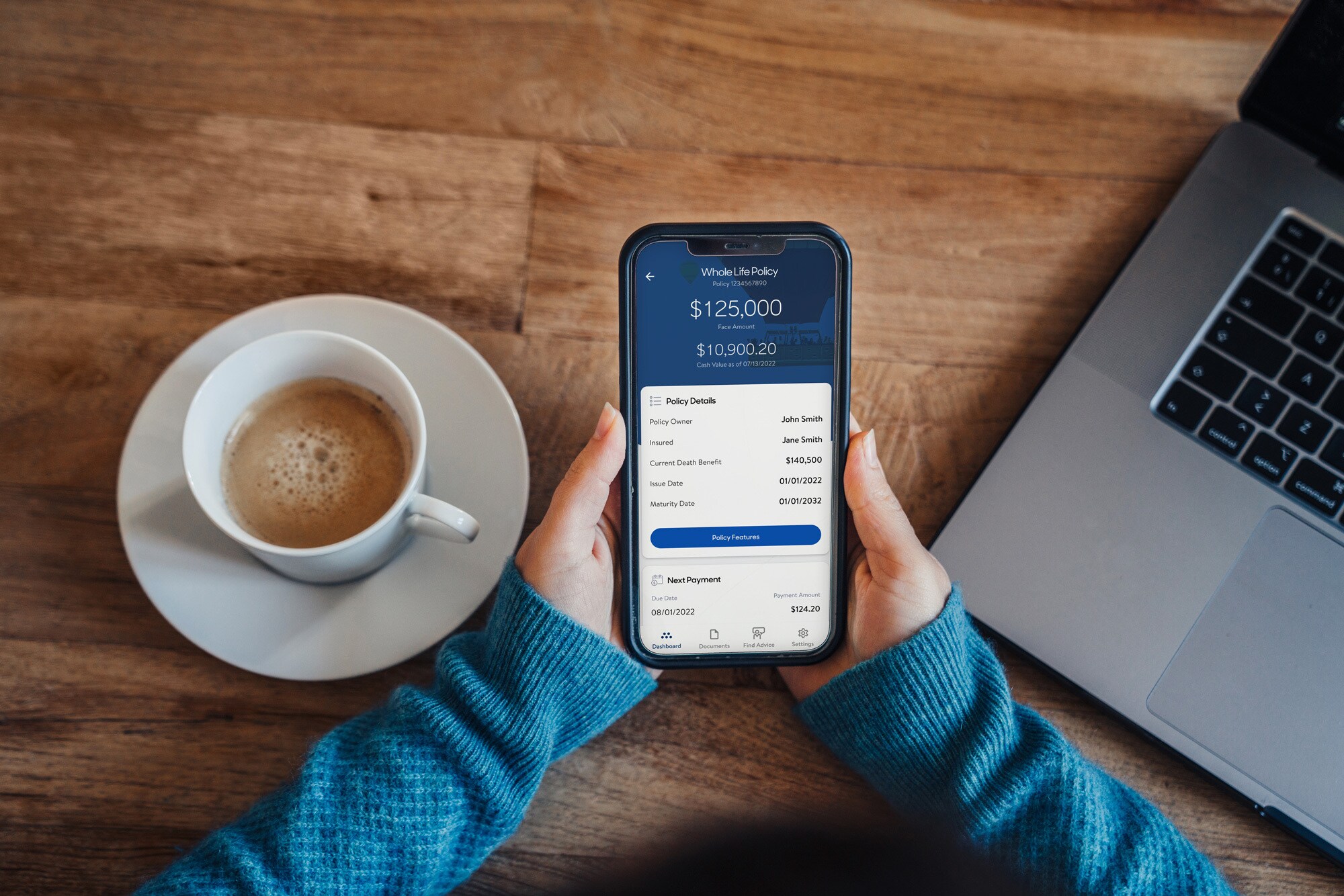 Hands holding a cell phone with MassMutual App