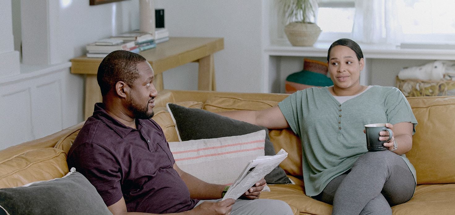 married couple sitting on the couch