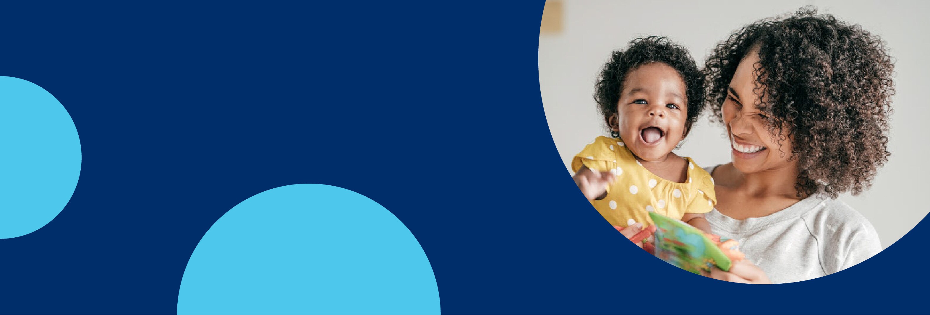 image of mother with short curly hair holding laughing baby in yellow top