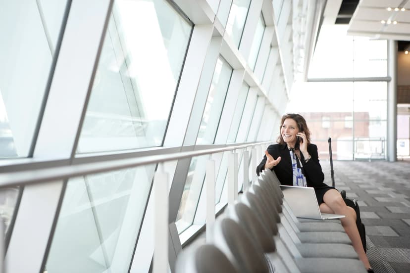 Woman sitting and talking on phone